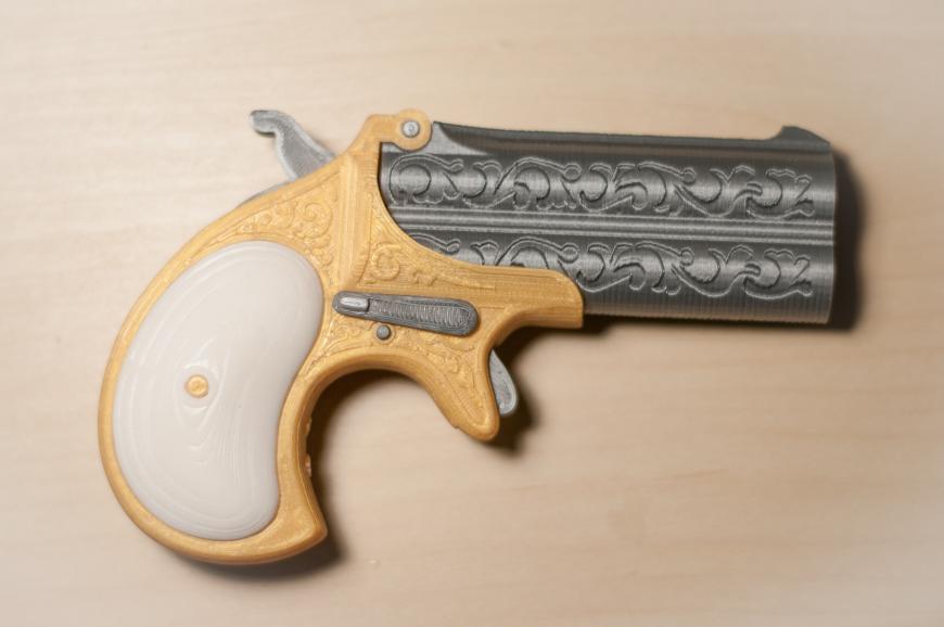 Модель карманного пистолета Remington Derringer