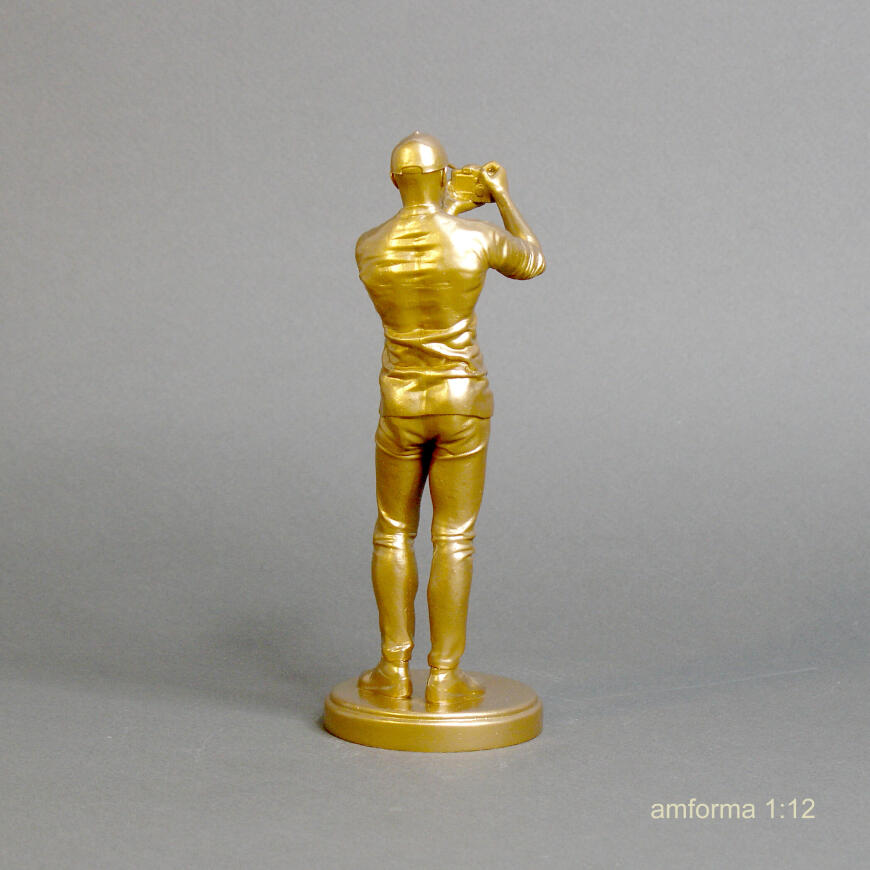 Статуэтка фотограф.