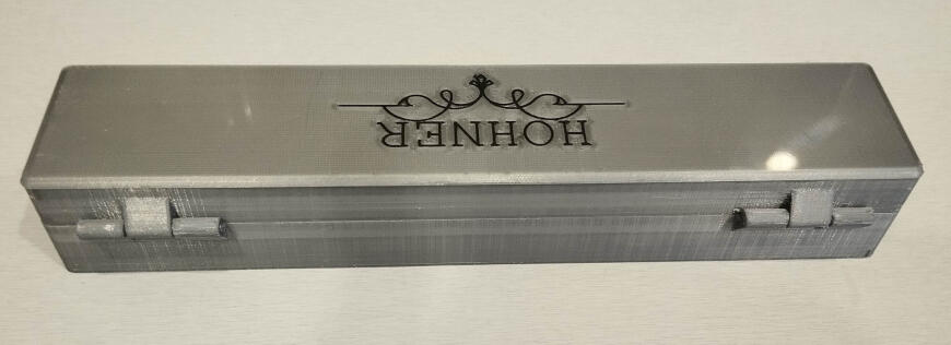 Футляр губной гармошки